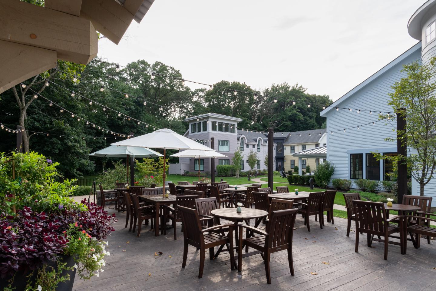 An outdoor patio of a hotel and restaurant