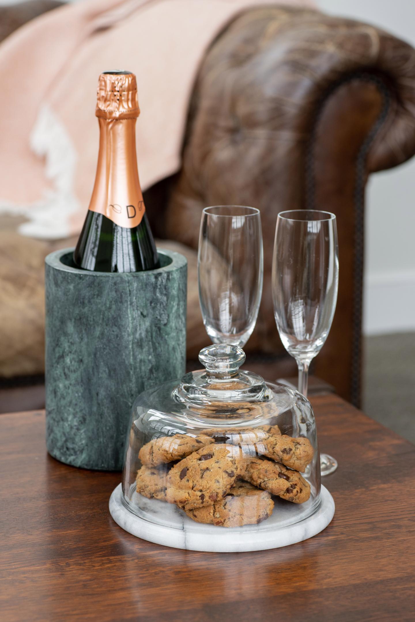 A close up of cookies and sparkling wine