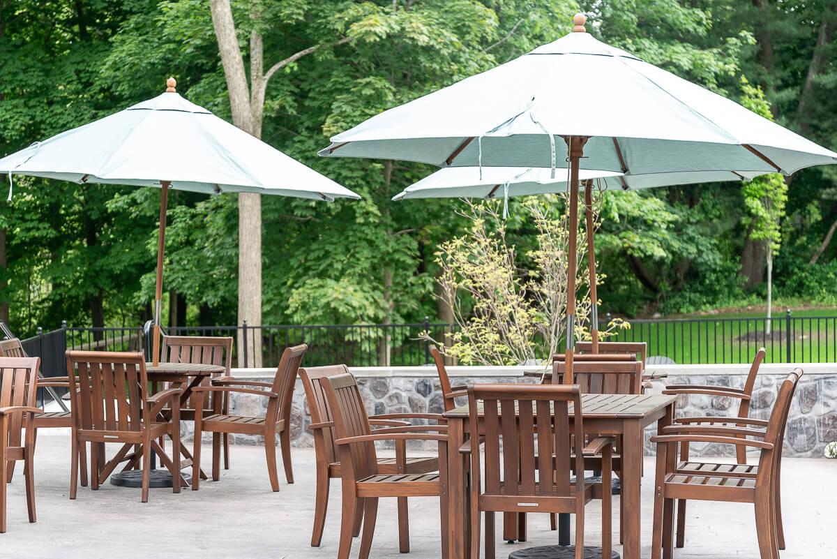 An outdoor patio with tables and chairs