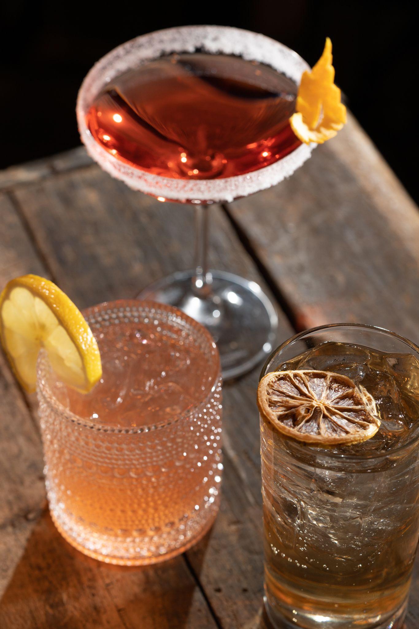 A close up of three cocktails