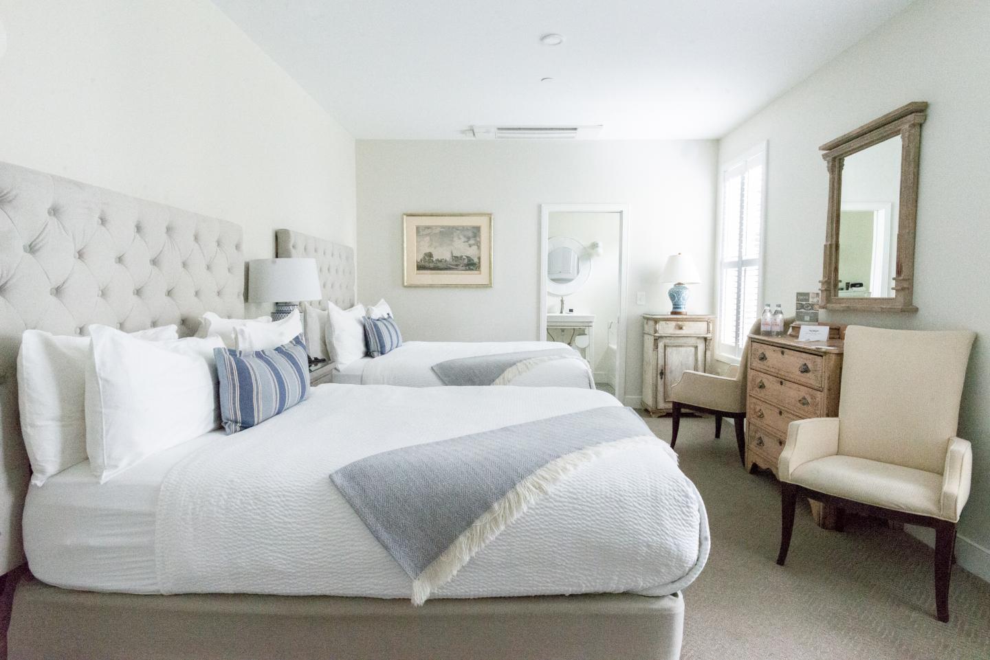 A hotel room with two beds