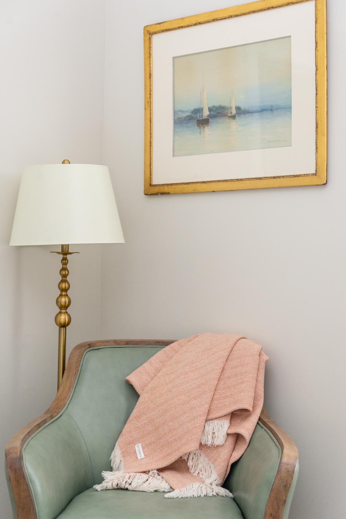 A chair, lamp and picture frame