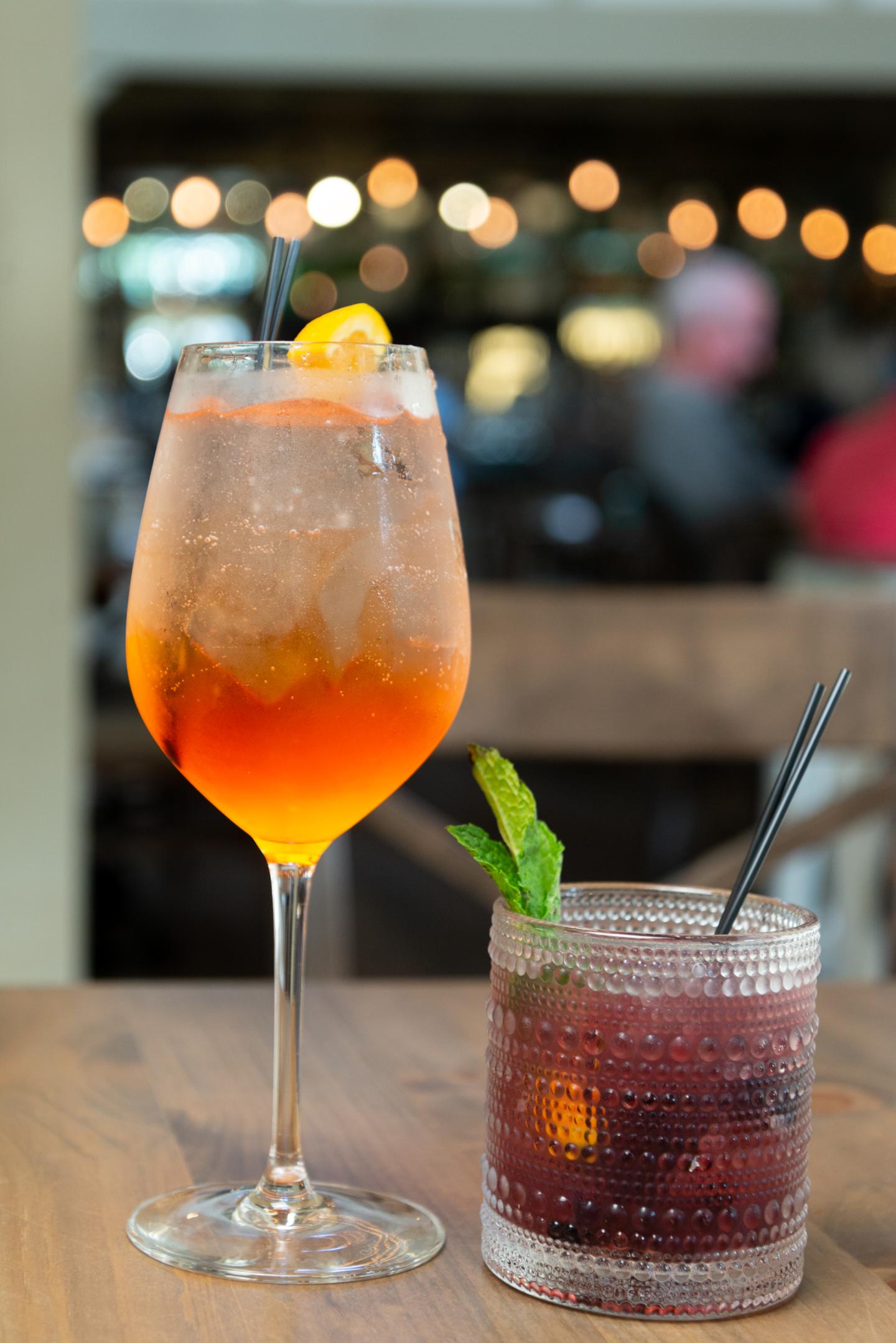 A close up of two cocktails
