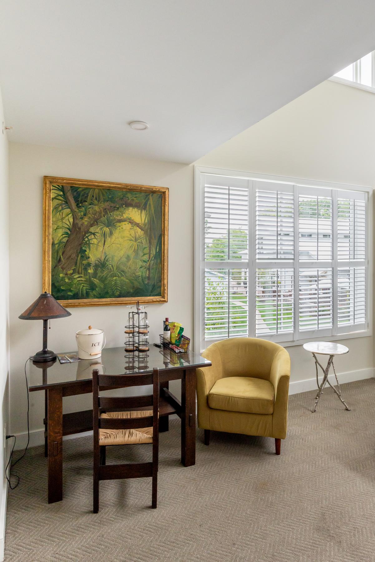 Grand King Suite at Briar Barn Inn - Desk, snacks, and view towards Grove